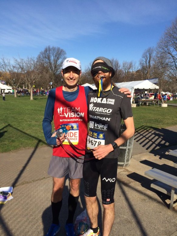 Mike Wardian and Chad Carr posing after the Blindfold Challenge at the BAA 5k