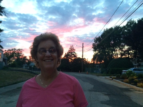 Cindy Wnetz outside with a sunset behind her